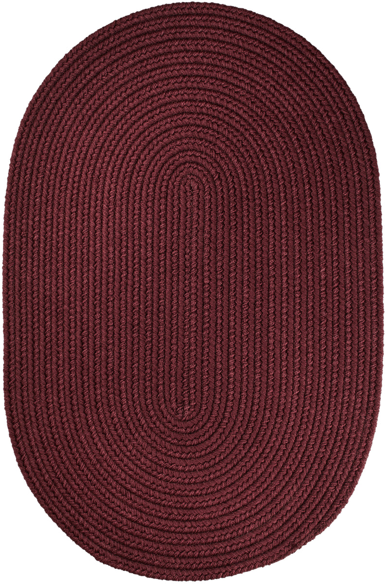 Solid Poly Burgundy braided indoor/outdoor rug by Rhody Rug — oval