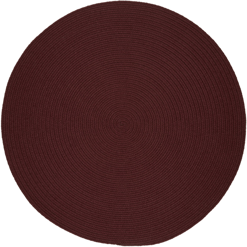 Solid Poly Burgundy braided indoor/outdoor rug by Rhody Rug — round