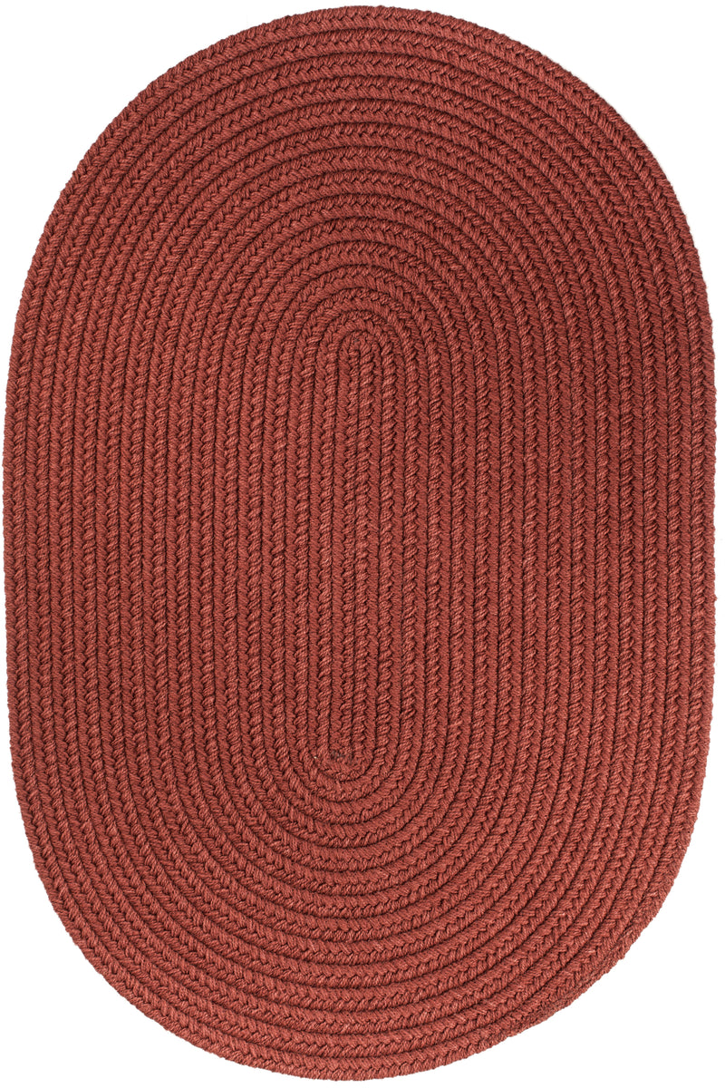 Solid Poly Terra Cotta braided indoor/outdoor rug by Rhody Rug — oval
